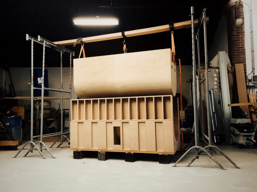wooden press used to build a rounded photo booth model
