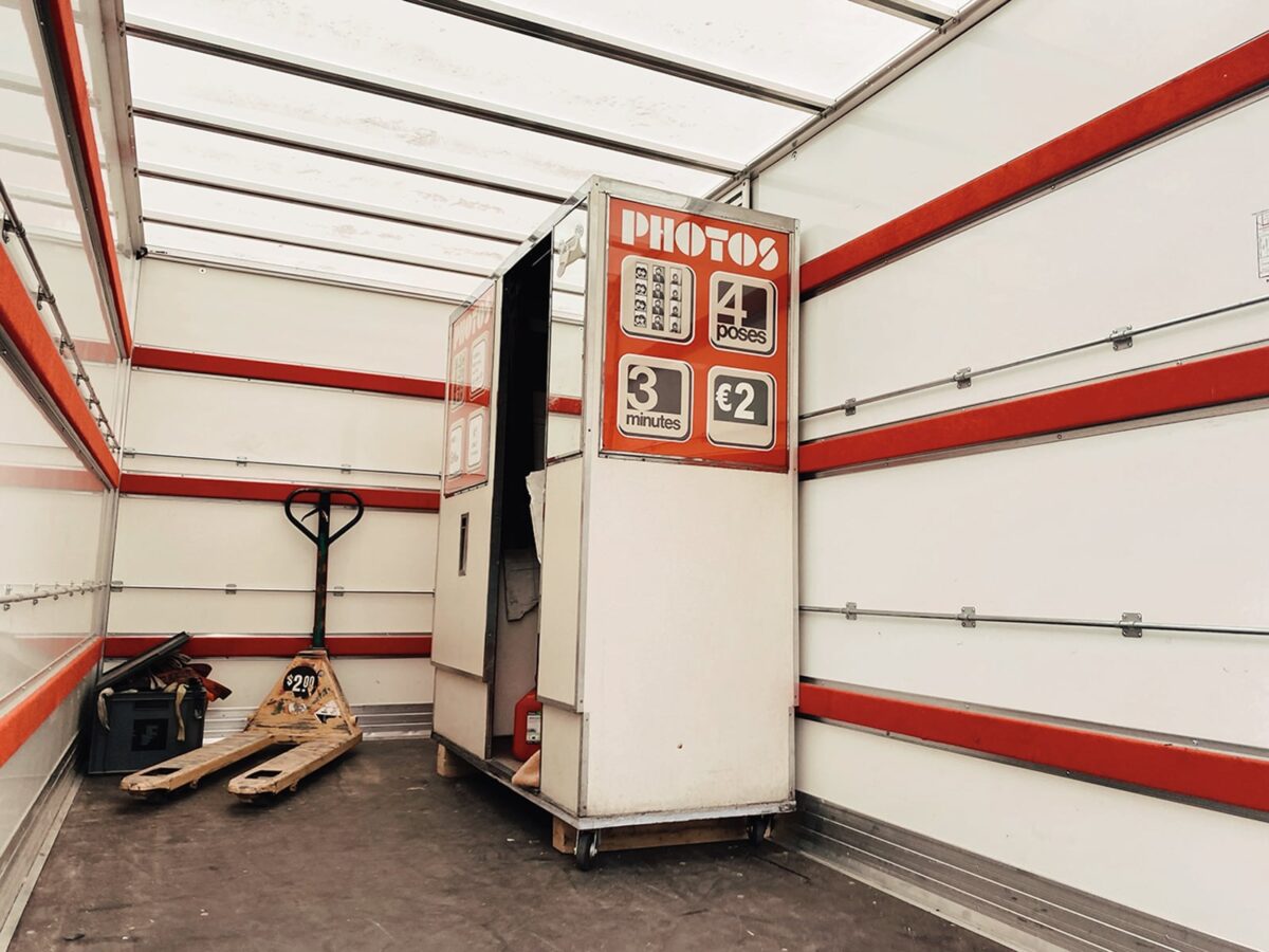 red photo booth in a transport truck