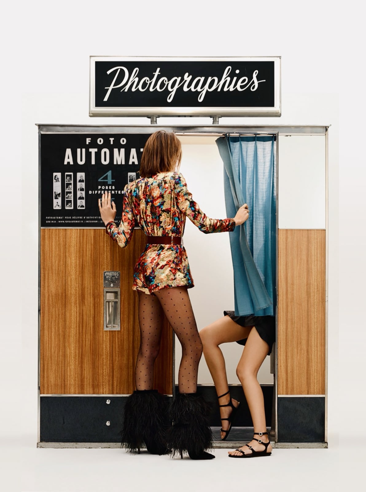 models posing in a photo booth for a shooting